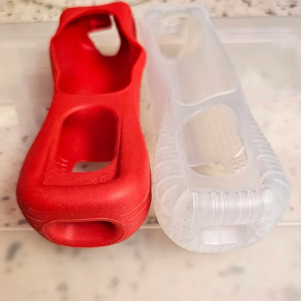 2 Wii silicone controller cases, EUC condition, OEM Nintendo, 1 red, 1 clear